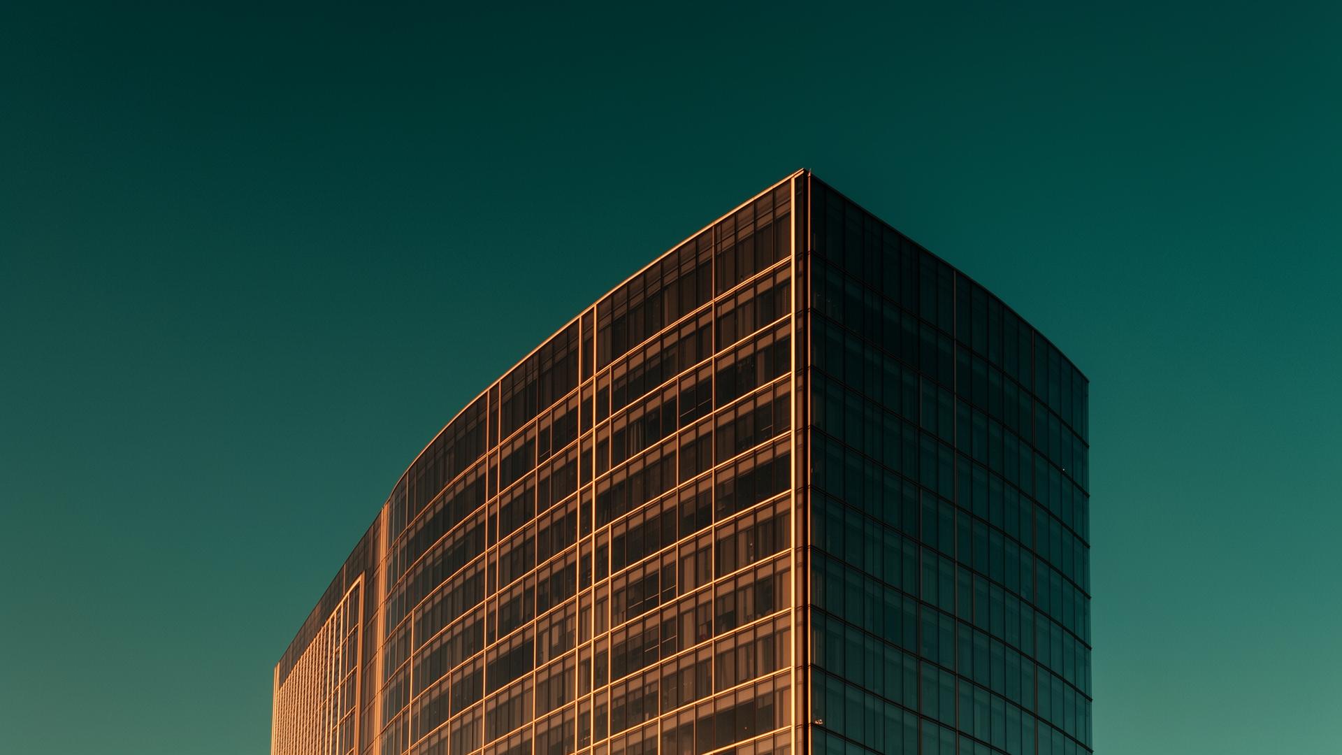 Cinematic modern corporate architecture at golden hour